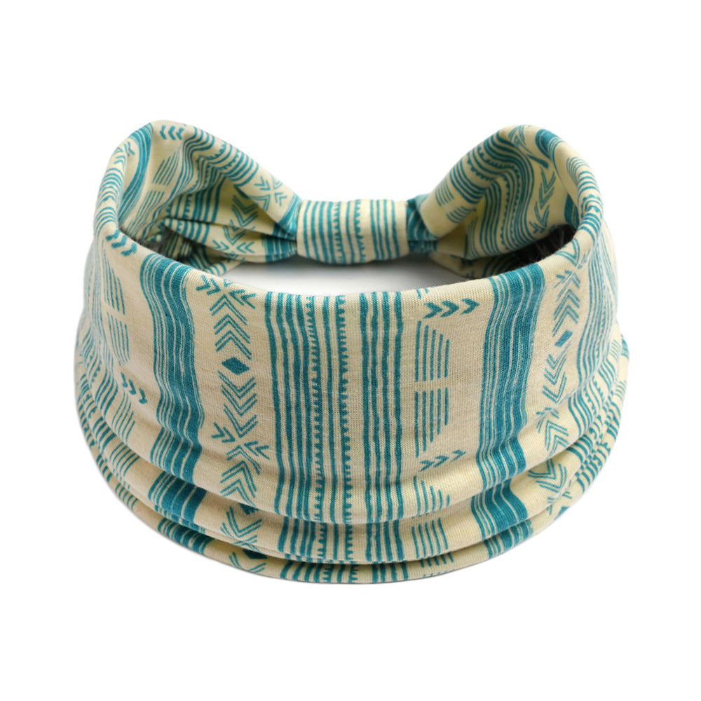 Bohemian Cashew Yoga Sports headband with turquoise geometric pattern on beige fabric