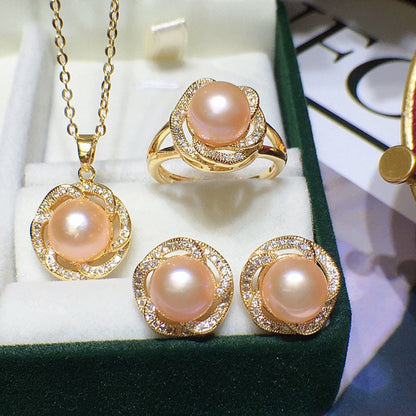 Freshwater pink pearl jewelry set, four-piece gold-tone with pavé crystals: necklace, ring, and two stud earrings.