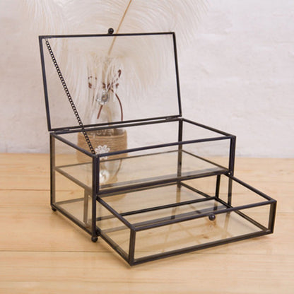 Jewelry storage display box with glass compartments in a black metal frame