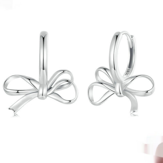 Pair of bow ear clips in S925 sterling silver, simple all-match design.