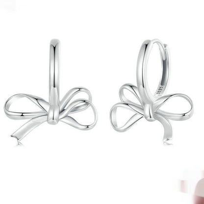 Pair of bow ear clips in S925 sterling silver, simple all-match design.