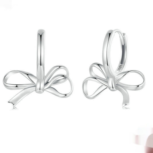 Pair of bow ear clips in S925 sterling silver, simple all-match design.