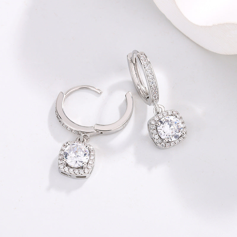Earrings, silver-tone hoops with square princess-cut moissanite halos and dangling pendants
