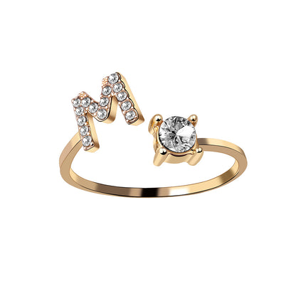 Ring gold-tone adjustable initial M with crystal-studded letter and a solitaire stone