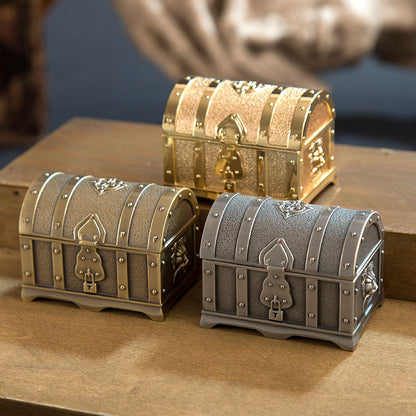 Three all-metal princess jewelry boxes in gold, silver, and gray with riveted detailing.