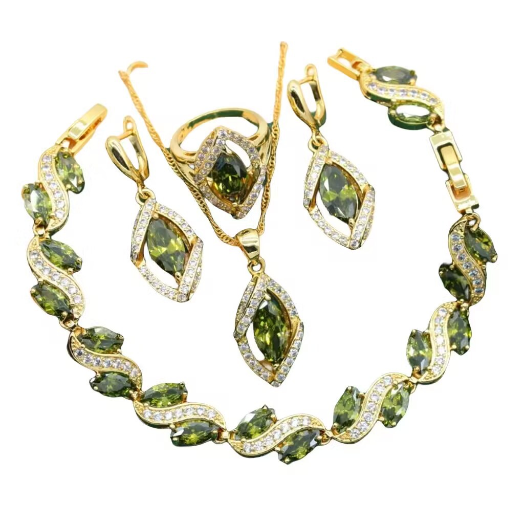 CJ gold-tone 4-piece jewelry set with green zircon stones: bracelet, necklace, earrings, ring