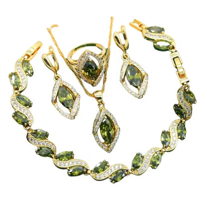 CJ gold-tone 4-piece jewelry set with green zircon stones: bracelet, necklace, earrings, ring