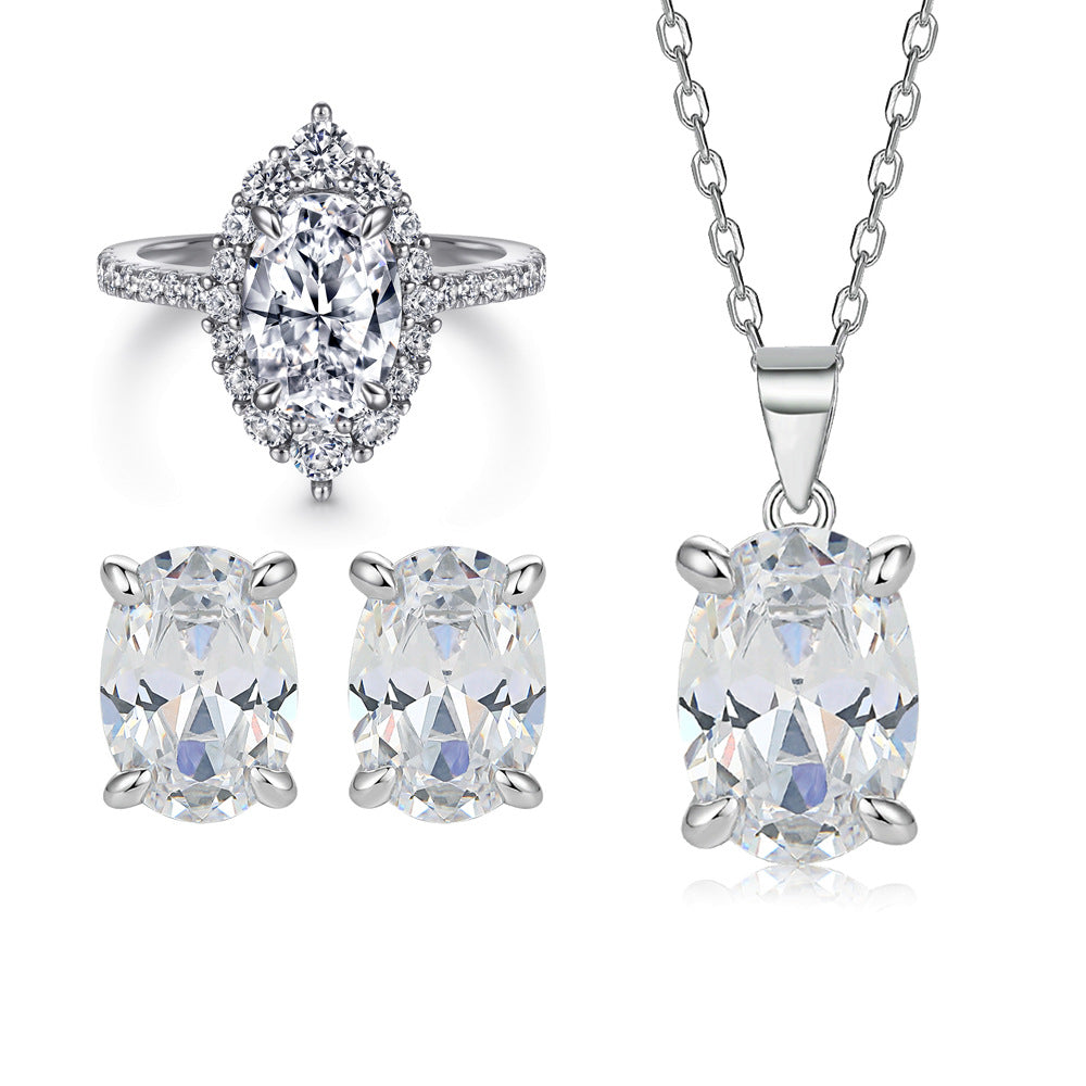 Oval gem pendant necklace with matching oval stud earrings and halo ring in silver-tone metal