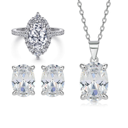 Oval gem pendant necklace with matching oval stud earrings and halo ring in silver-tone metal