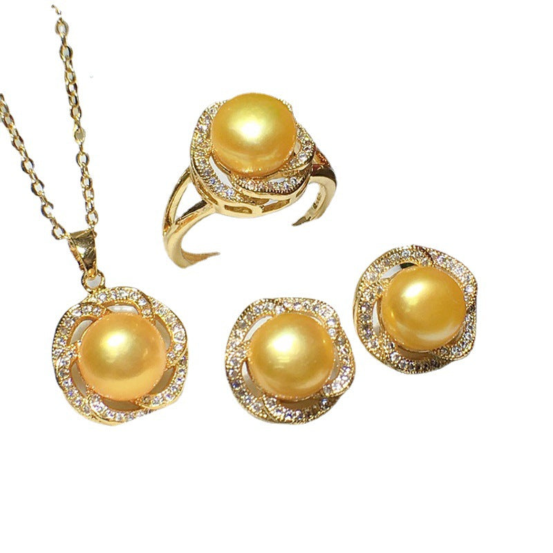 Freshwater pearl jewelry set by cj; gold-tone necklace pendant, ring, and two earrings with pavé halos and yellow pearls, 4-piece.