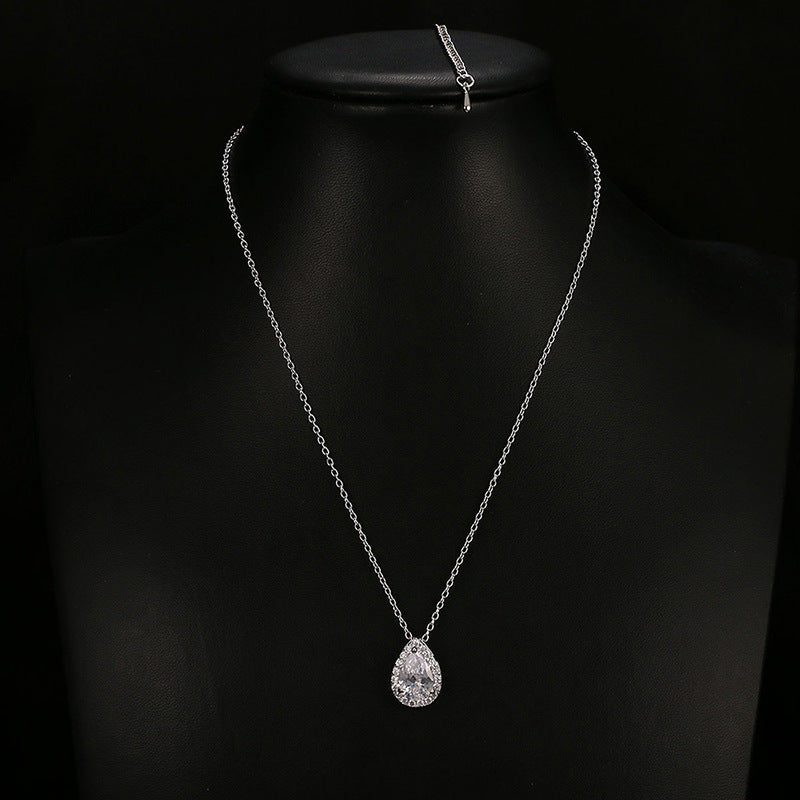 Water Drop Gemstone Necklace with silver chain and teardrop pendant on black display