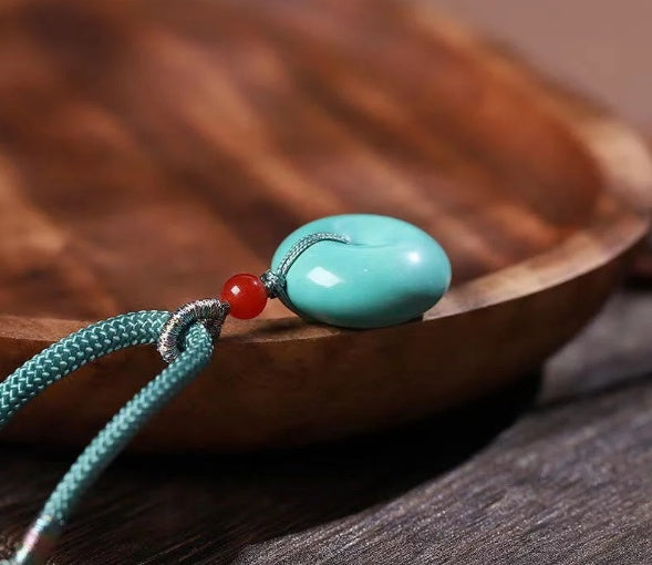 High Porcelain Turquoise Bread Ring Safety Buckle necklace with teal cord and red bead by cj