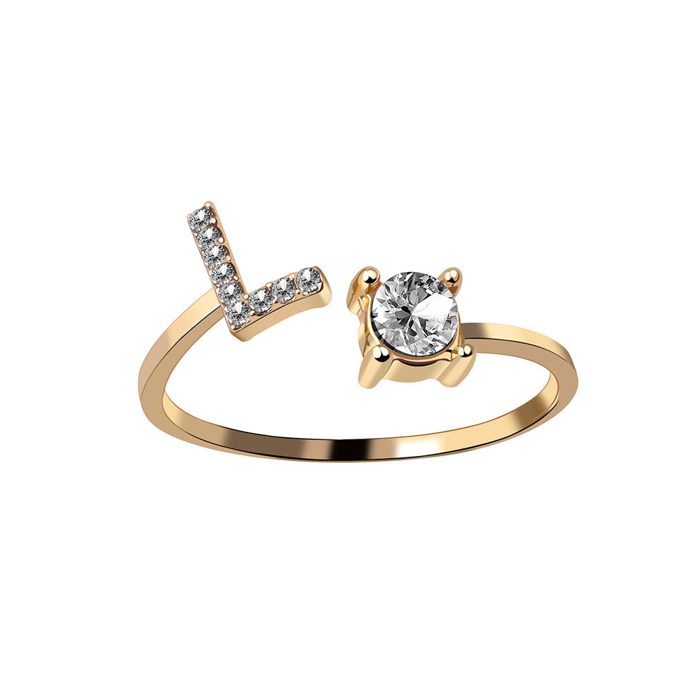 Gold-tone adjustable initial L ring with pavé stones and a solitaire crystal