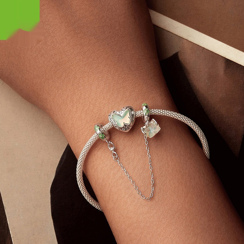 Bracelet: 925 silver beaded chain with butterfly charm and green enamel accents