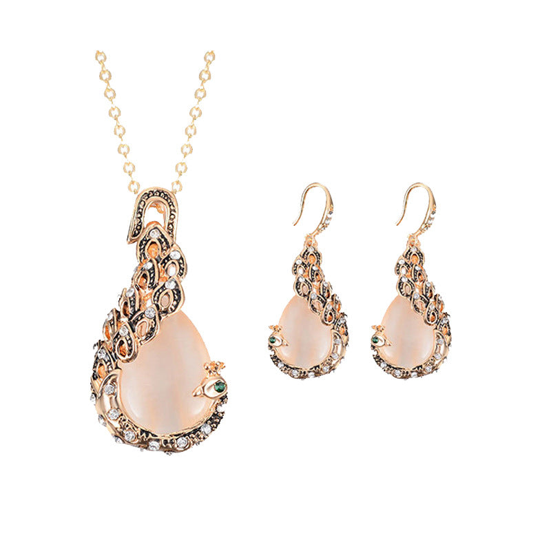 3-piece bridal jewelry set: rose-gold peacock gem necklace with matching earrings and crystal accents