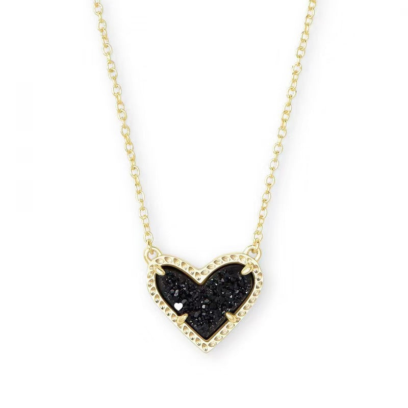 Cubic Zirconia Heart Pendant Necklace in gold-tone with a black heart centerpiece and beaded bezel