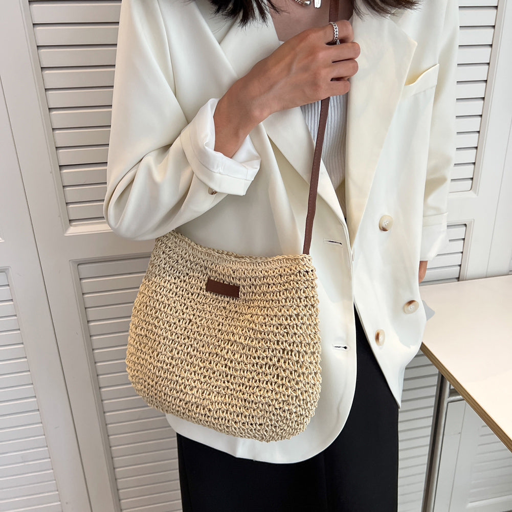 Niche Design Vacation Straw Tote Bag with natural woven straw and brown shoulder strap