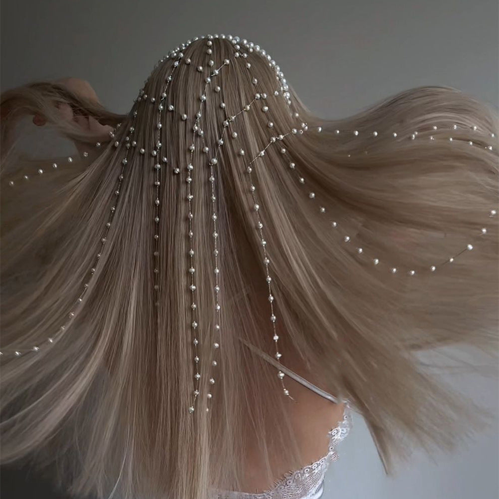 High-end pearl hairband with cascading pearl strands on blonde hair