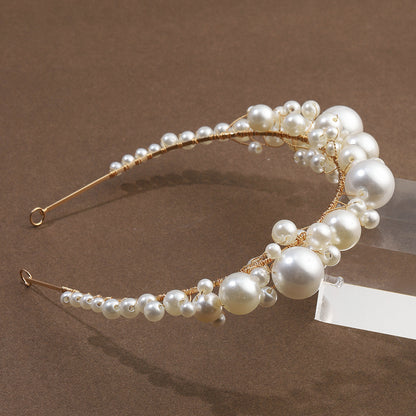 Pearl bridal headband with gold-tone wire and simple white pearls, retro vintage style