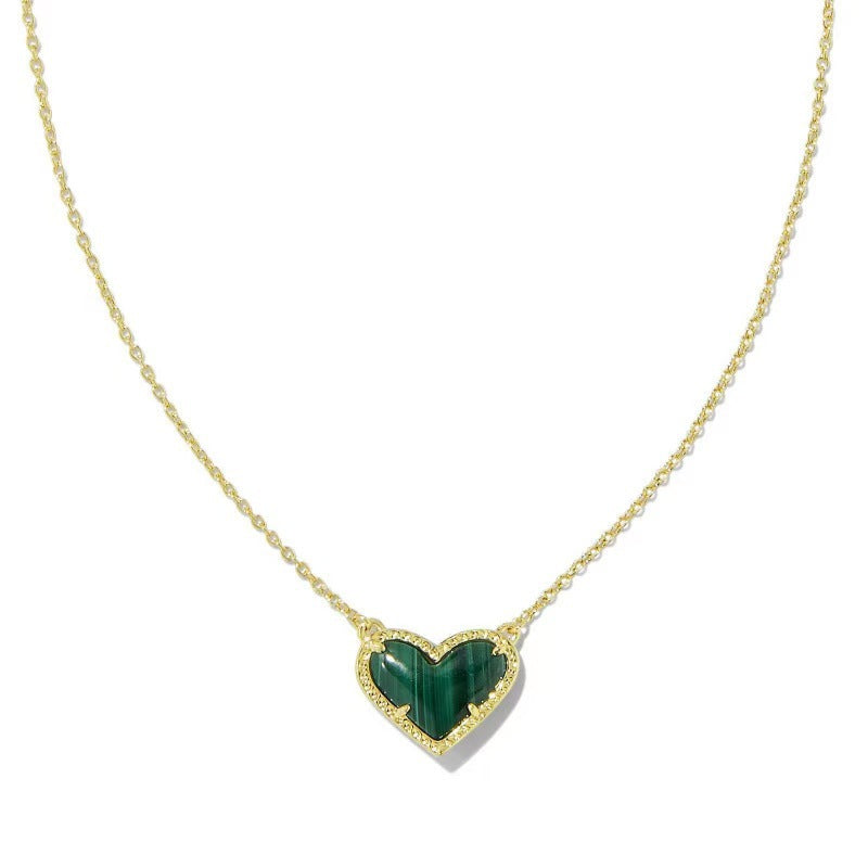 Cubic Zirconia Heart Pendant Necklace with gold-tone chain and green heart centerpiece with pave border