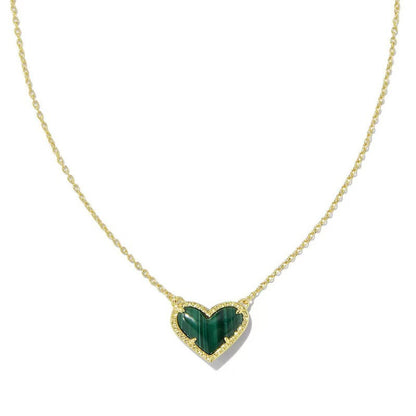 Cubic Zirconia Heart Pendant Necklace with gold-tone chain and green heart centerpiece with pave border