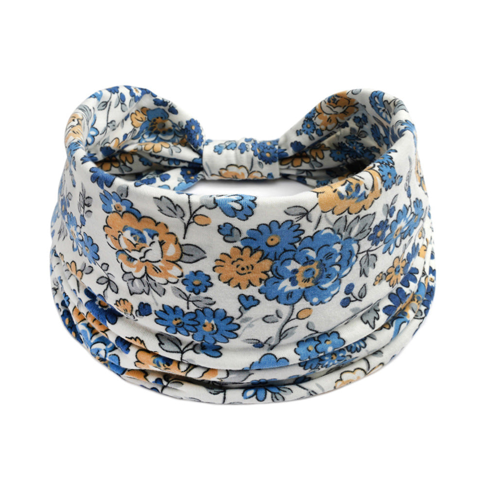 Bohemian Cashew Yoga Sports Headband with blue and orange floral pattern on white fabric
