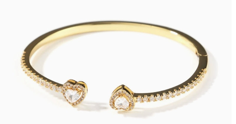 Gold-tone circle bracelet with diamond-accented band and two heart-shaped ends