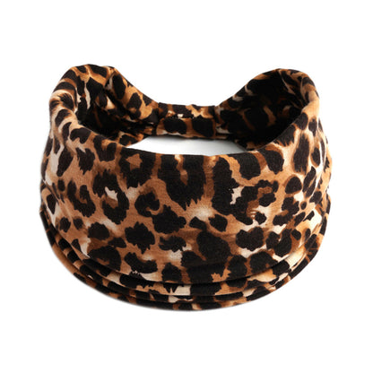 Yoga headband in leopard print; absorbent, bohemian style accessory.