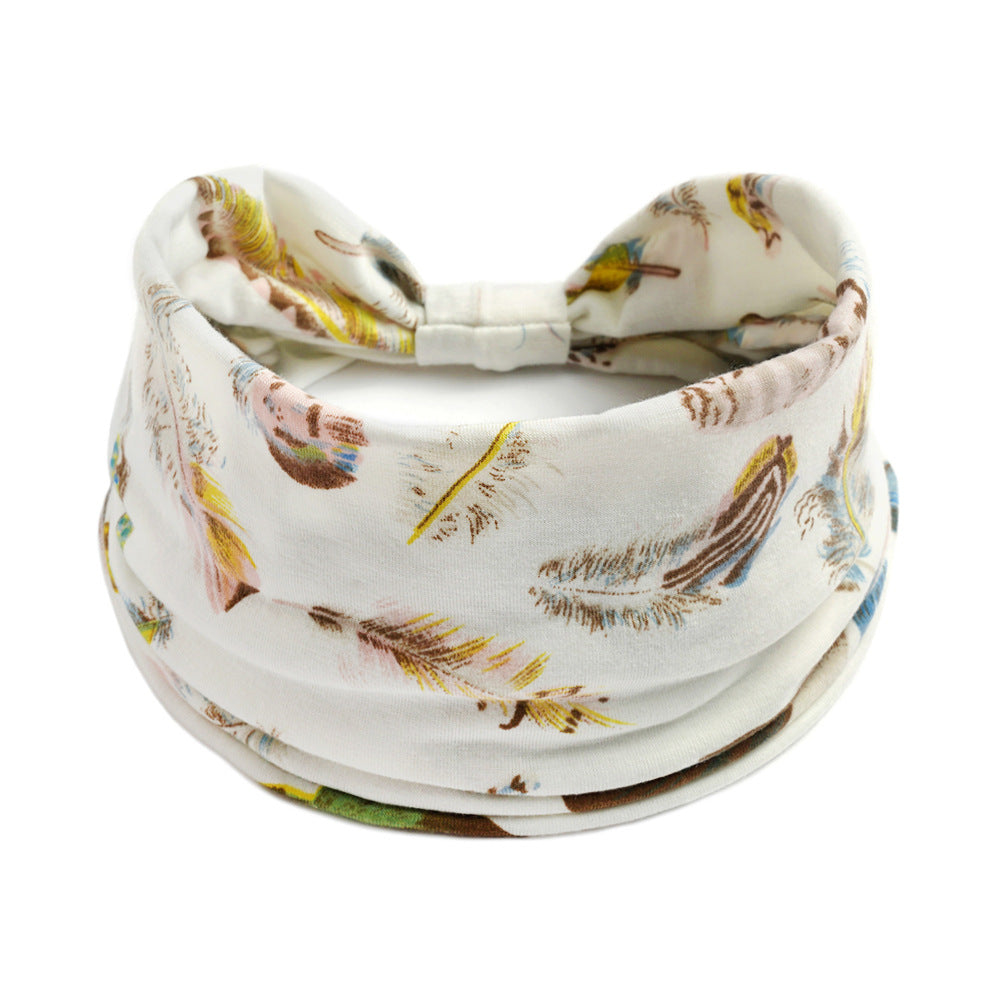 Bohemian Cashew yoga headband, white with colorful print; absorbent, elastic sports accessory