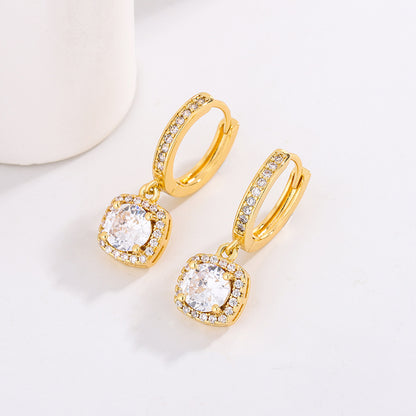 Earrings by CJ: gold-tone hoops with square halo and moissanite center stones, pair.