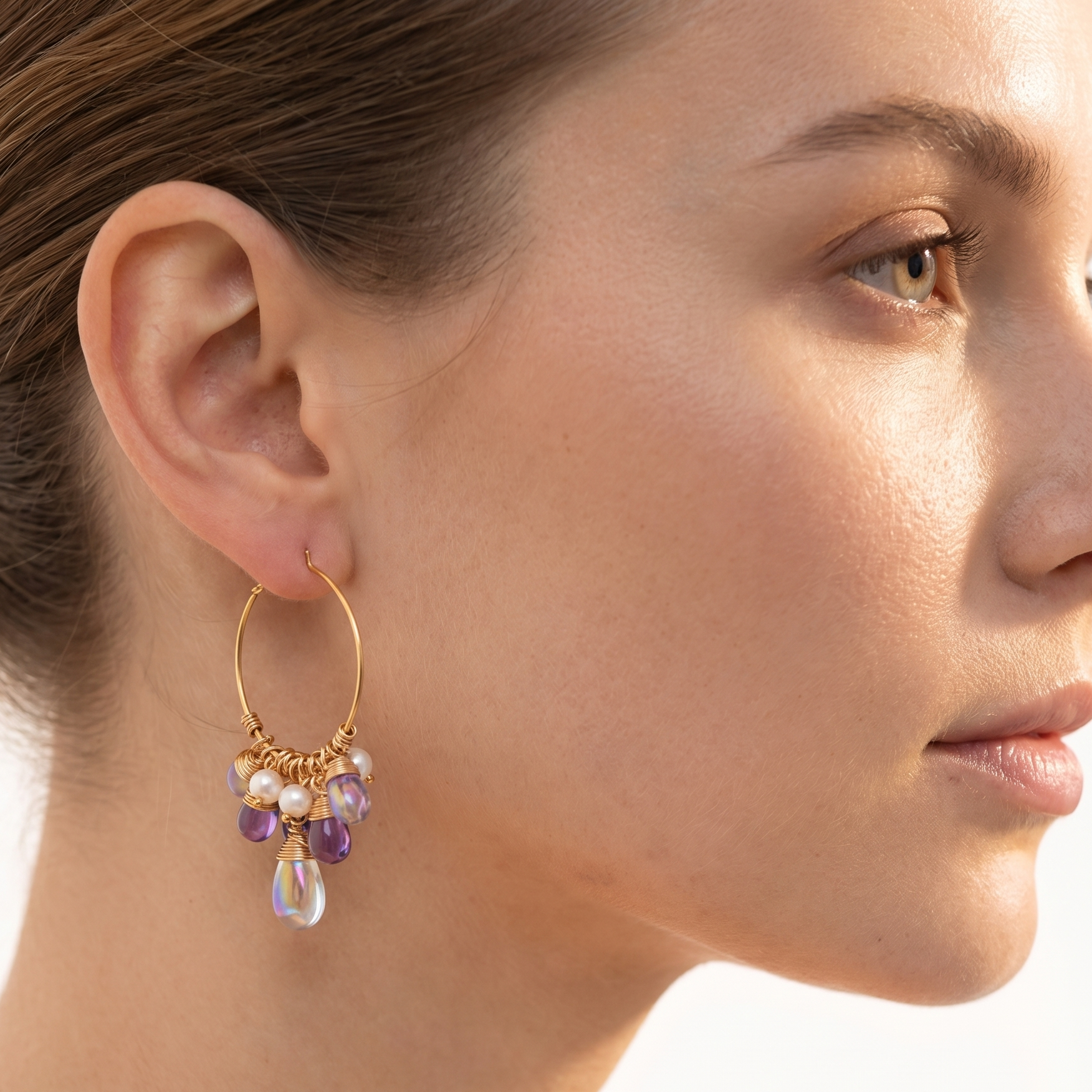 Pearl Czech crystal earrings with gold-tone hoops and dangling purple teardrop beads