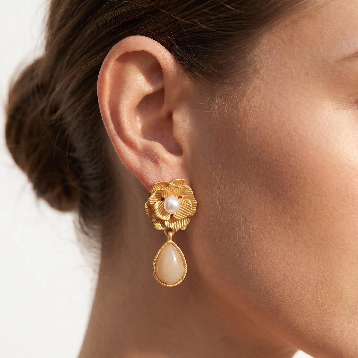 Opal Ice Flower Stud Earrings; gold-tone floral design with pearl centers and a dangling teardrop pearl