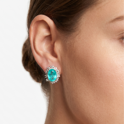 Vintage earrings featuring a turquoise oval centerpiece with a diamond halo