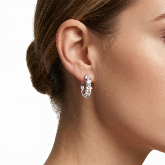 Silver Moissanite hoop earrings with clear stones.