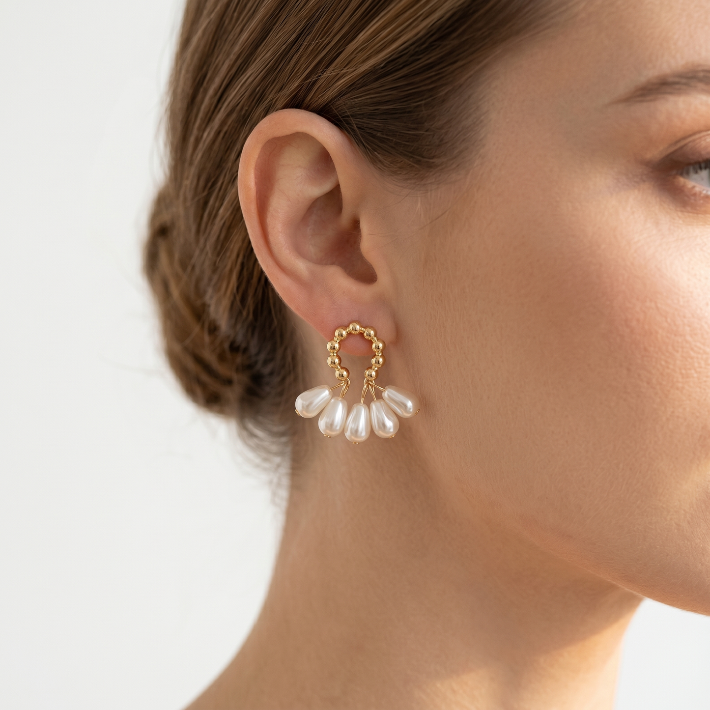 Baroque pearl hoop earring in gold-tone beads with dangling pearls